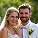 Grace and Thomas smiling after their wedding