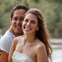 Smiling newlyweds Jemima and Oliver enjoying their day